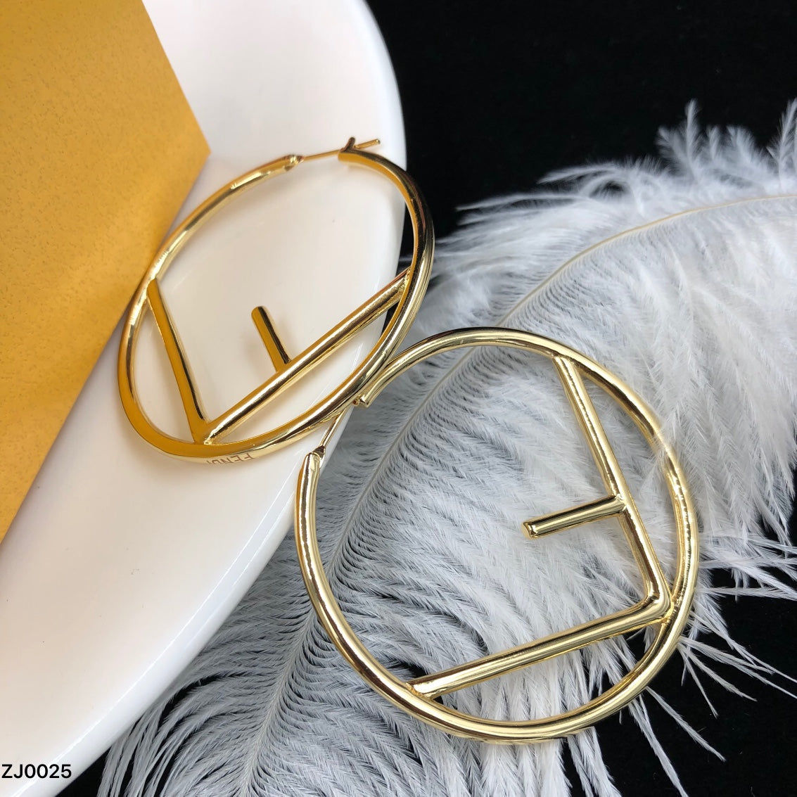 F gold earrings